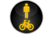 Svět. signály „Signál žlutého světla ve tvaru chodce a cyklisty“. Signály „Signál žlutého světla ve tvaru chodce a cyklisty“, jimiž je doplněn signál se zelenou šipkou směřující vpravo nebo vlevo, upozorňují řidiče, že při jízdě směrem, kterým tato šipka ukazuje, křižuje směr chůze přecházejících chodců a směr jízdy přejíždějících cyklistů. TestImage